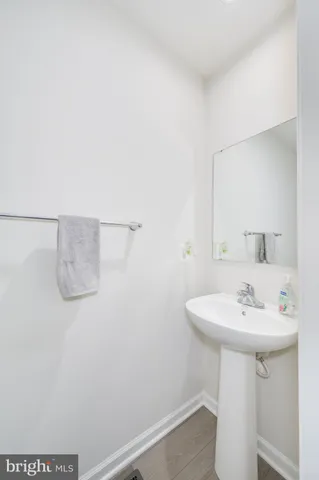 a bedroom with a bed and a lamp