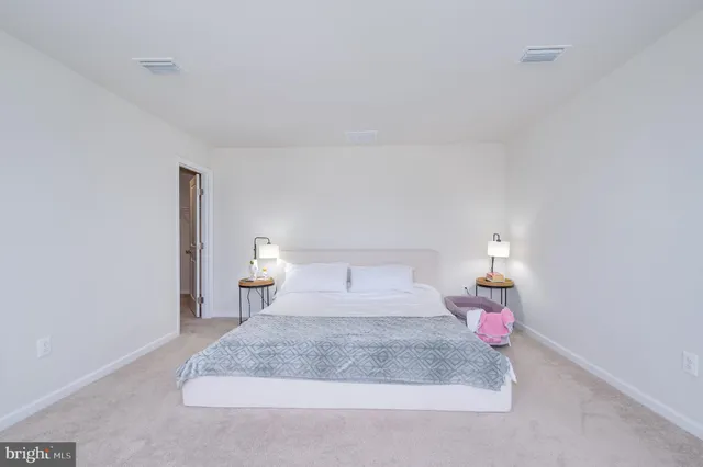 a living room with furniture and windows