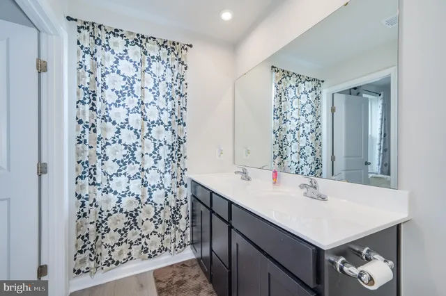 a view of a bedroom with a window and gate