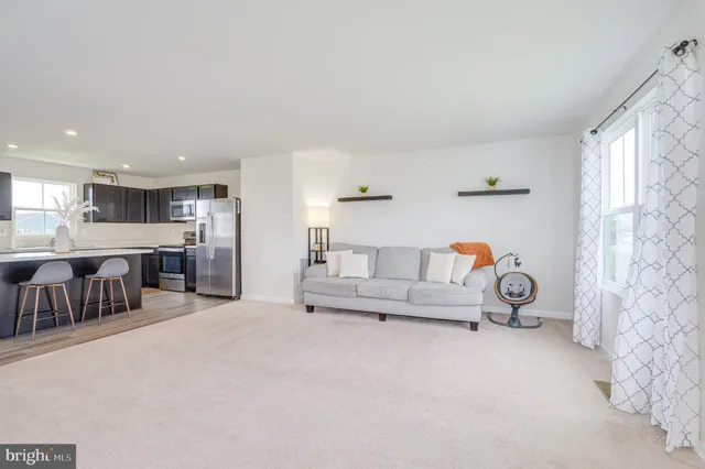 a living room with furniture and a table