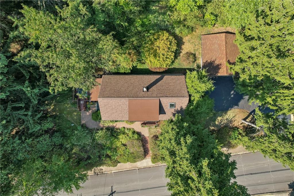 Another aerial view showing the 2 car garage and the newer roof.