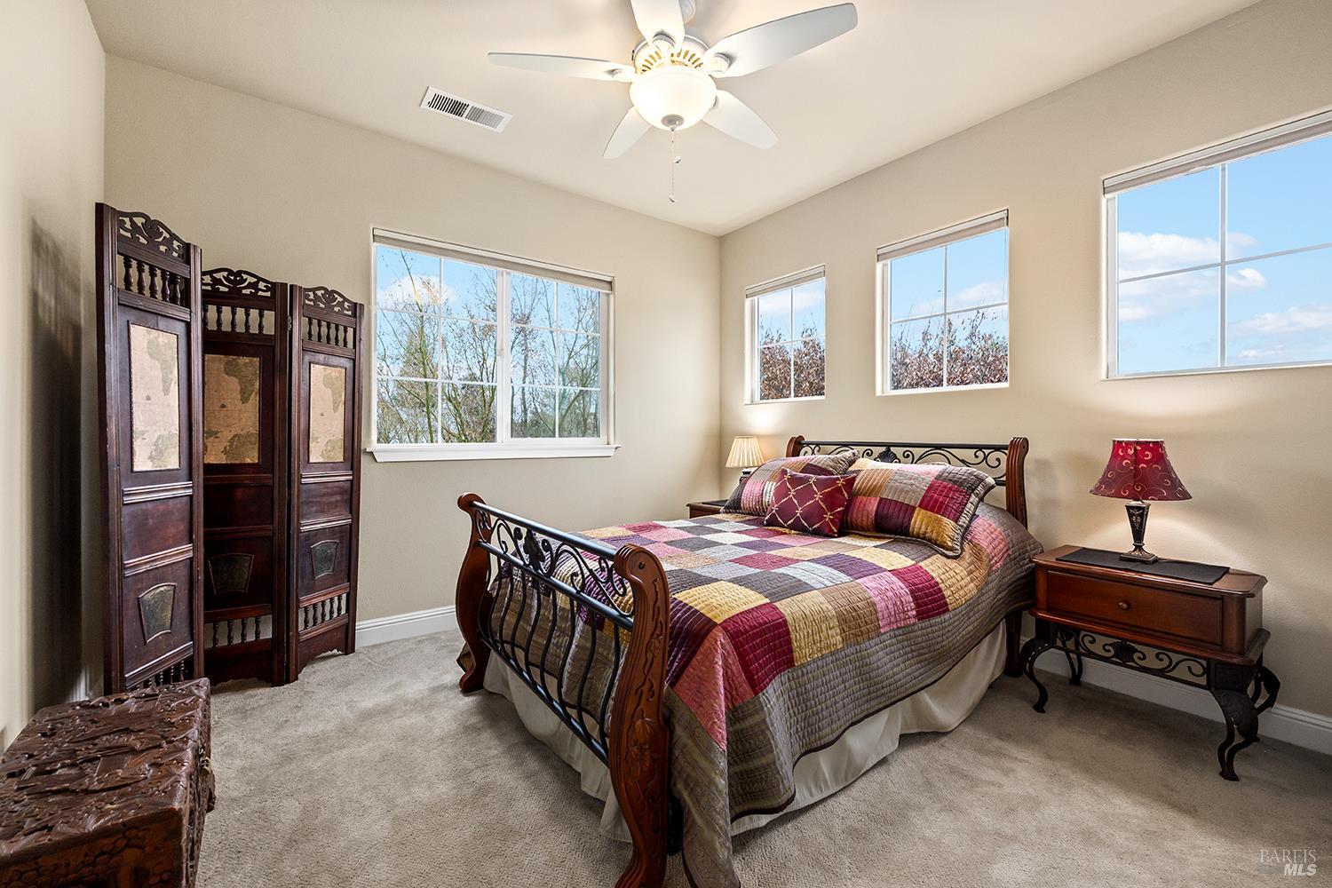 3696 Newbury Court Santa Rosa, CA 95404 - Photo 31 of 52 a bed room with a bed and a chandelier