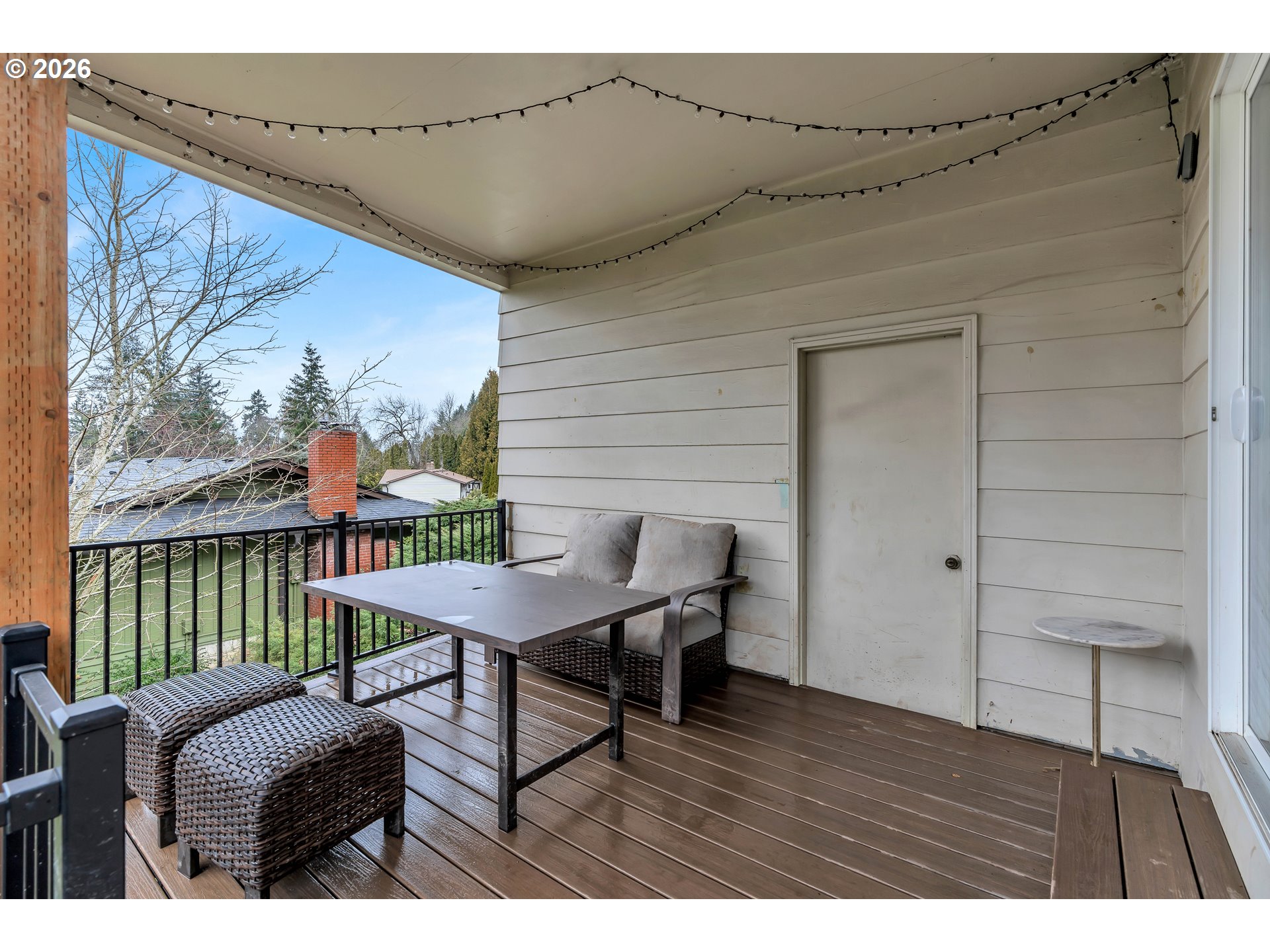 1320 Southwest 31st Street Gresham, OR 97080 - Photo 13 of 48 a balcony with furniture and wooden floor