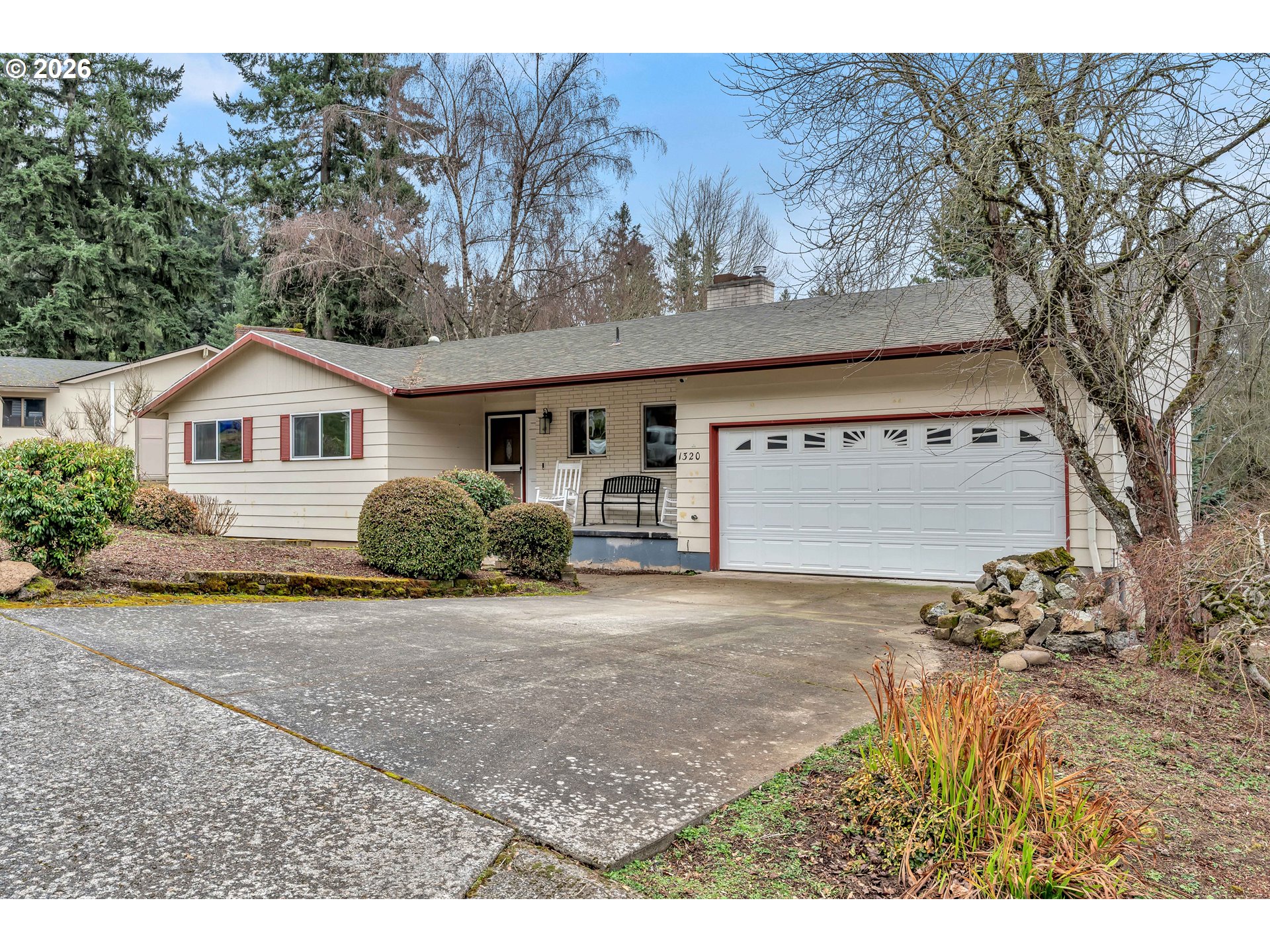 1320 Southwest 31st Street Gresham, OR 97080 - Photo 2 of 48 a front view of a house with a yard and garage