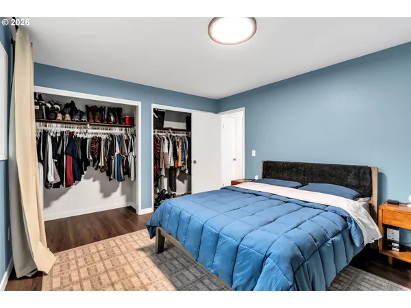 a bedroom with a bed and closet
