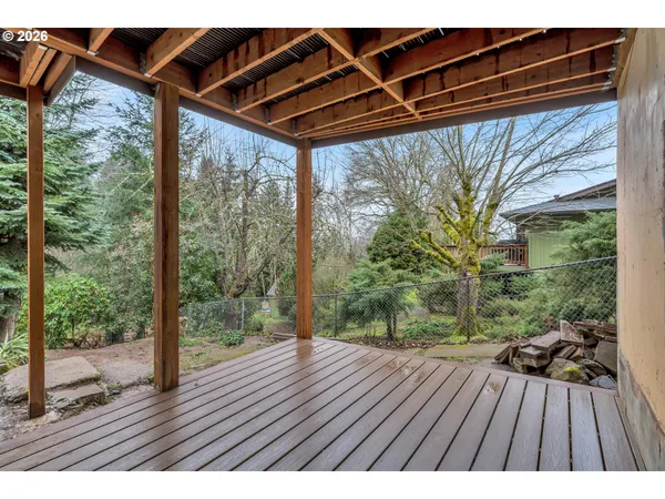 a view of outdoor space with wooden floor