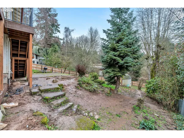 a view of a backyard with trees