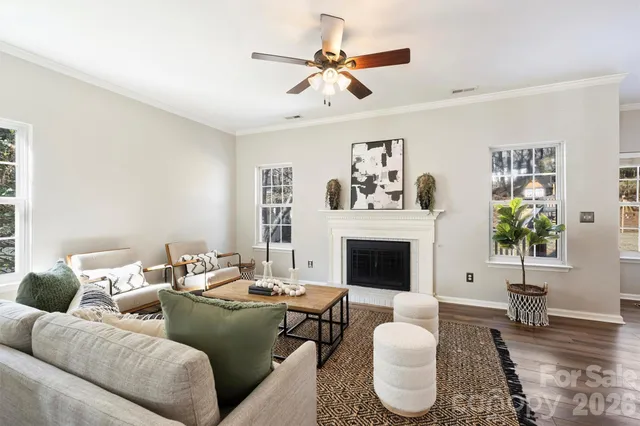 a kitchen with stainless steel appliances granite countertop a table chairs refrigerator sink and cabinets