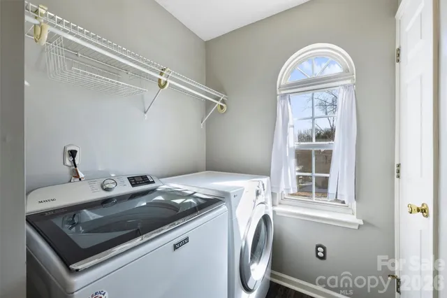 a bathroom with a double vanity sink mirror and shower