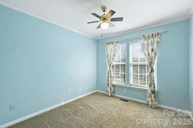 a bathroom with a toilet a sink a mirror a shower and vanity