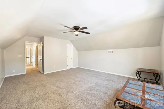 a front view of a house with sitting area