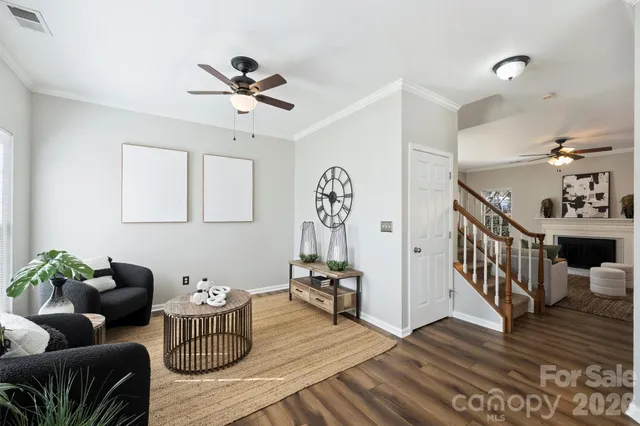 a living room with furniture potted plant and a window