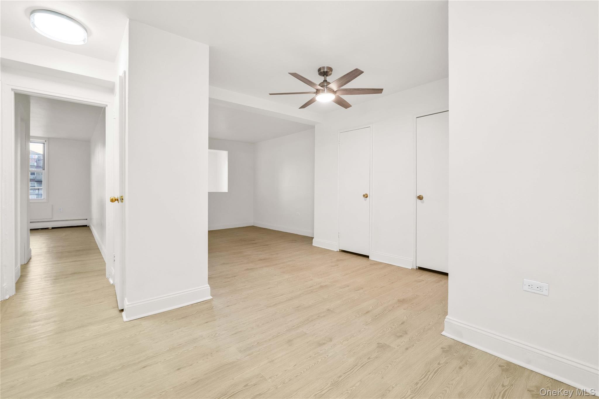 34-20 Parsons Boulevard, Unit 4W Queens, NY 11354 - Photo 6 of 17 a view of a big room with closet and fan