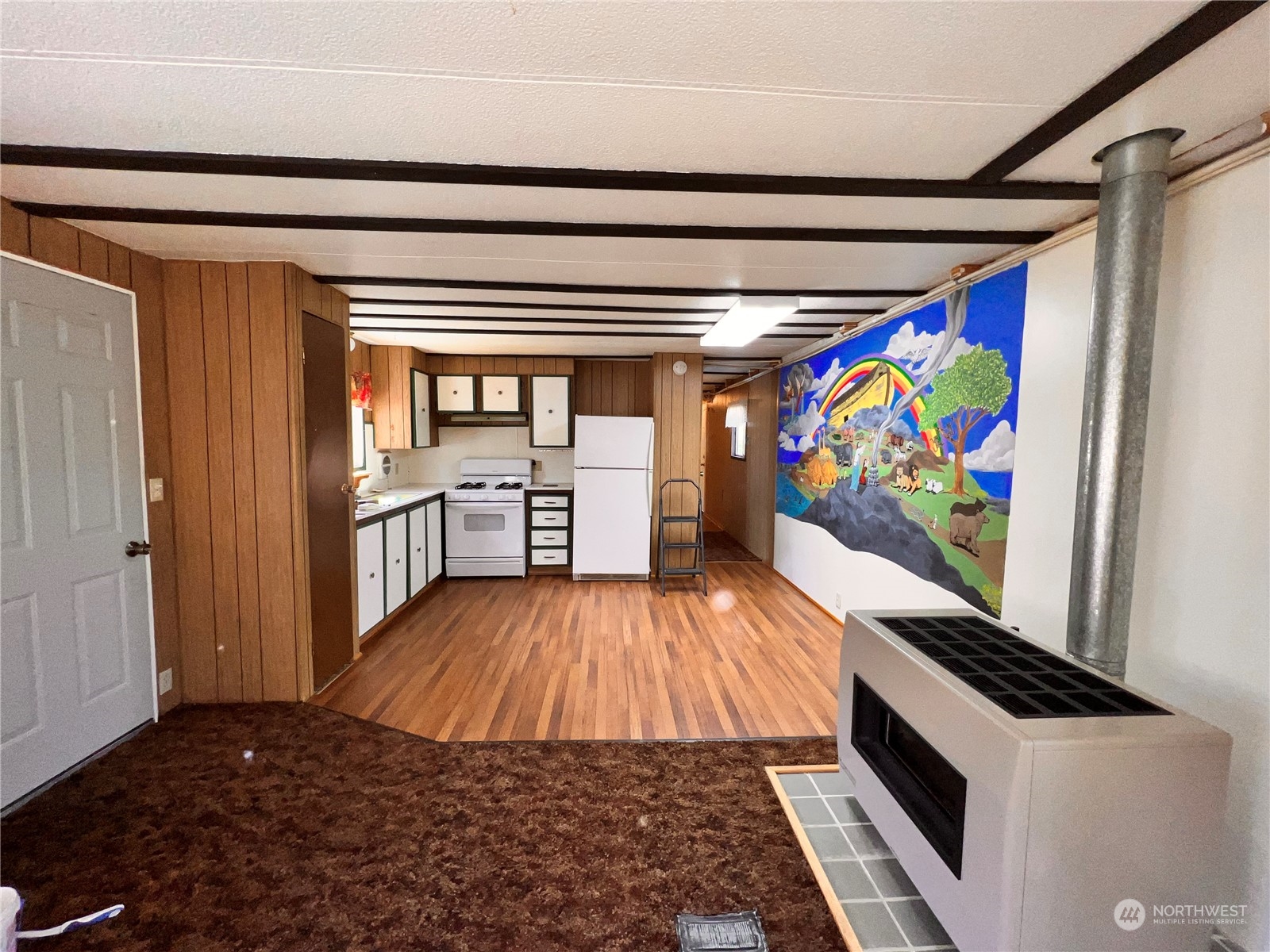 44 Vista Drive Republic, WA 99166 - Photo 6 of 28 a view of a hallway with wooden floor and furniture
