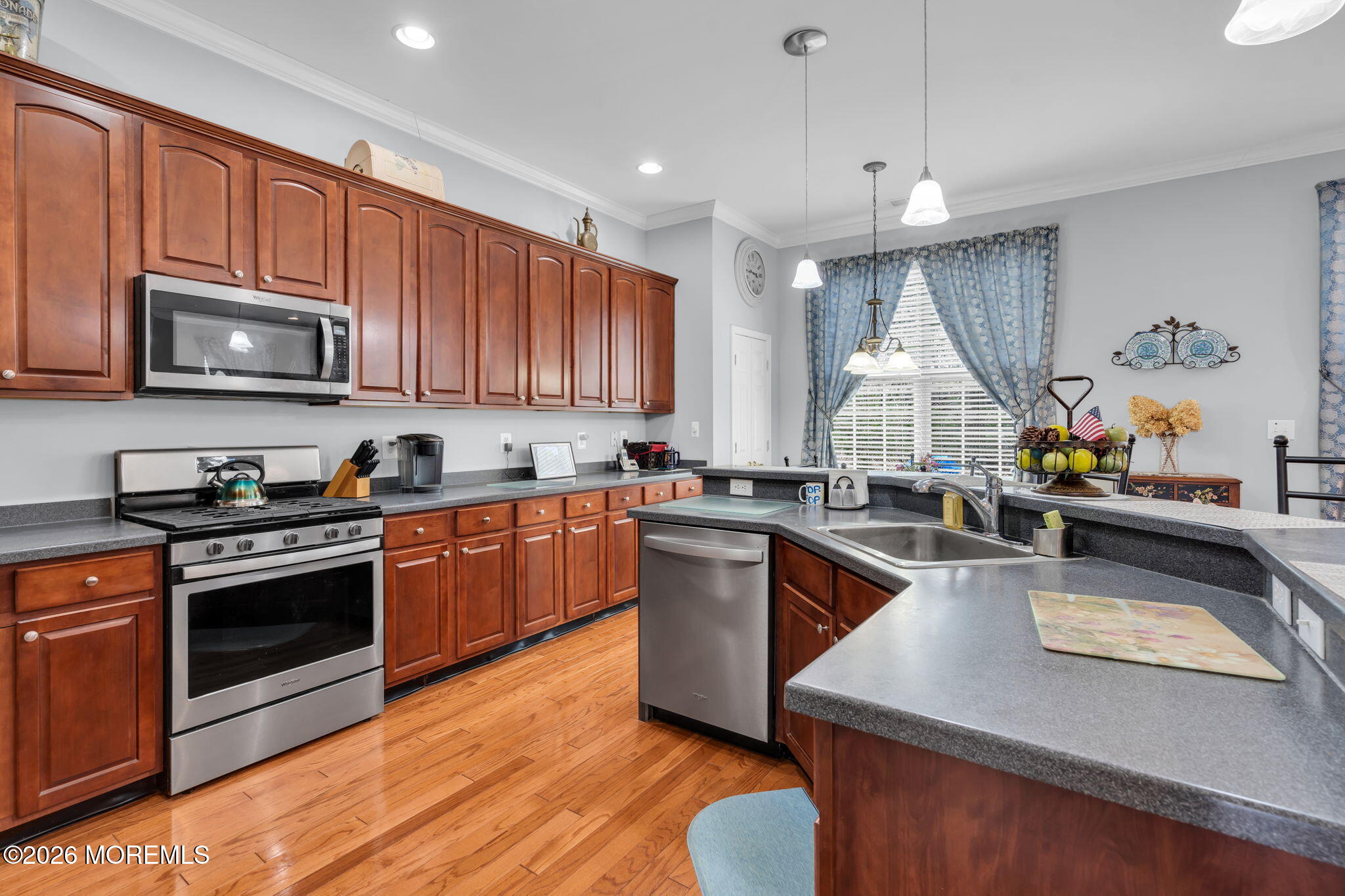 56 Pond View Circle Barnegat, NJ 08005 - Photo 11 of 32 a kitchen with stainless steel appliances granite countertop a stove a sink dishwasher a microwave oven and a refrigerator with wooden cabinets
