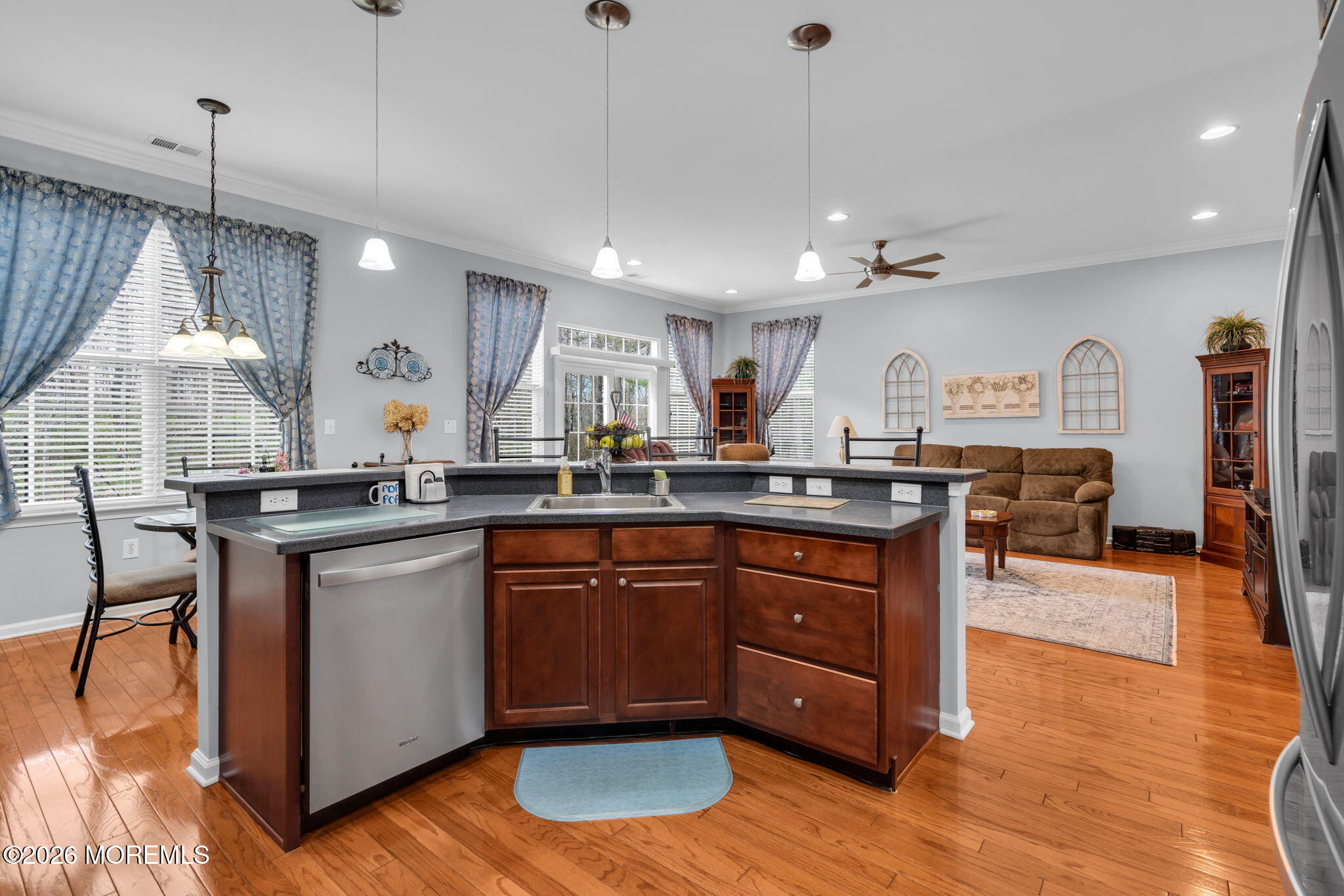 56 Pond View Circle Barnegat, NJ 08005 - Photo 13 of 32 a kitchen with stainless steel appliances granite countertop wooden floors wooden cabinets a sink and a island