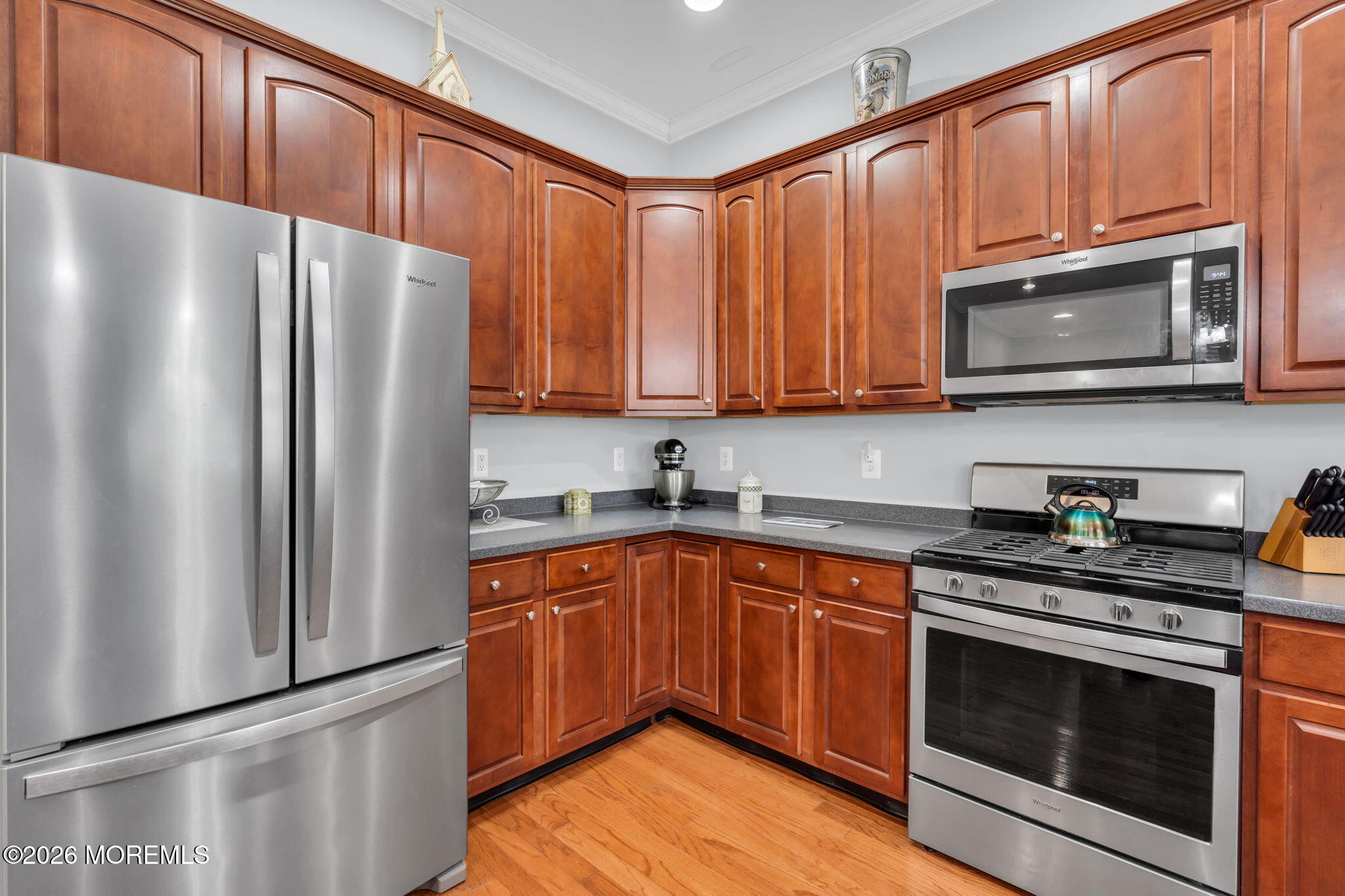 56 Pond View Circle Barnegat, NJ 08005 - Photo 14 of 32 a kitchen with granite countertop wooden cabinets stainless steel appliances and a window