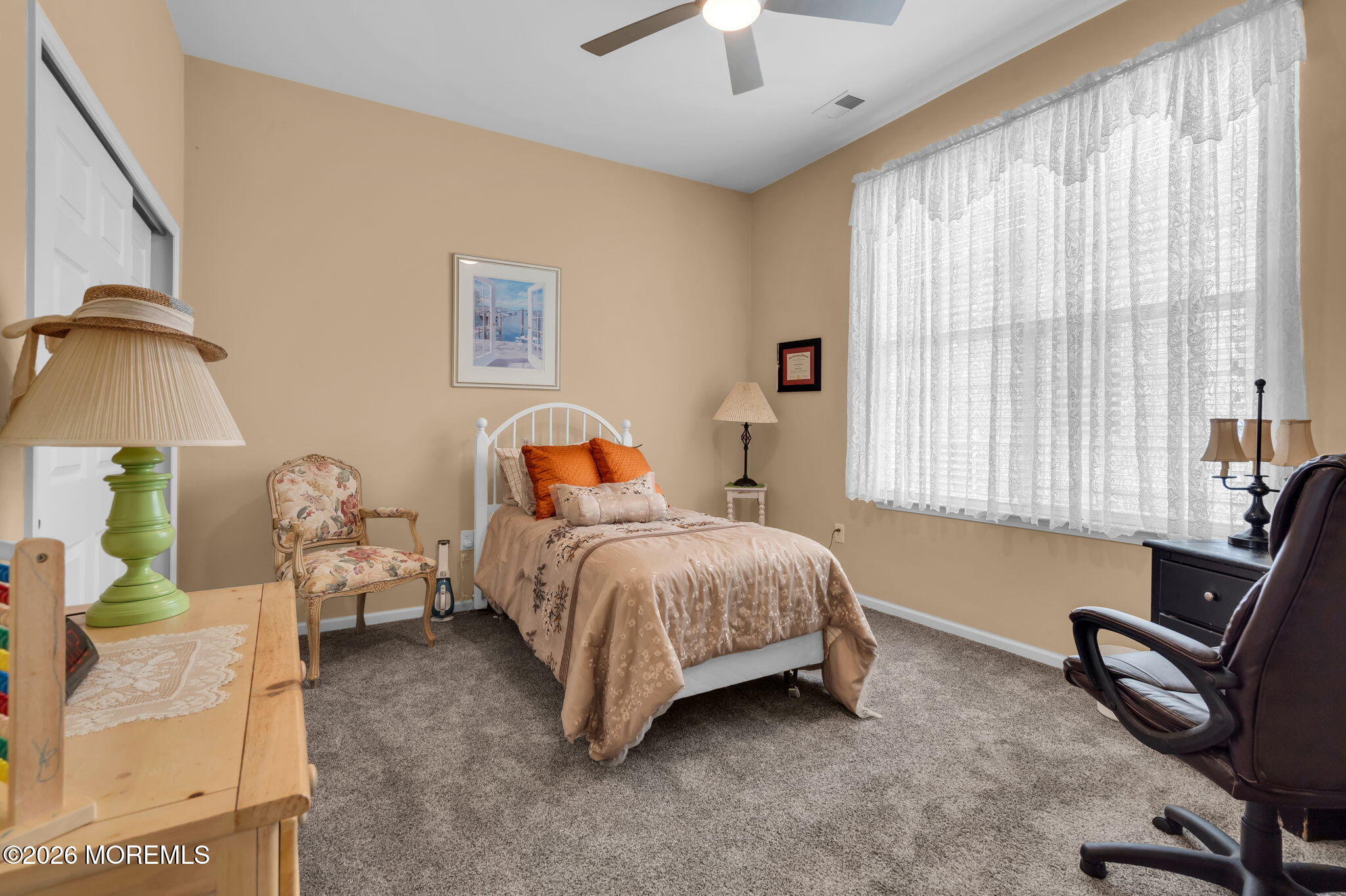 56 Pond View Circle Barnegat, NJ 08005 - Photo 19 of 32 a bedroom with a bed and a chandelier