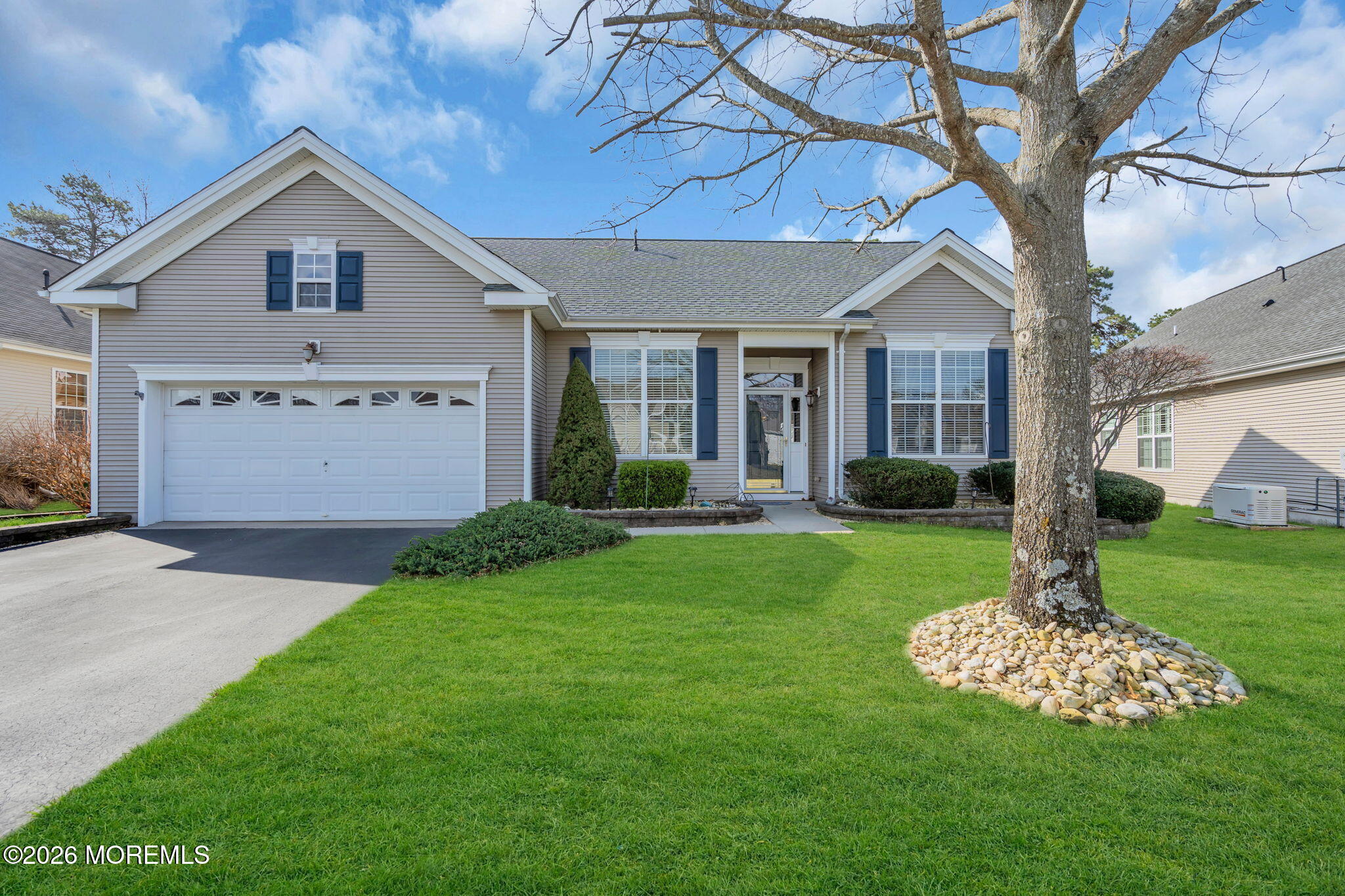 56 Pond View Circle Barnegat, NJ 08005 - Photo 2 of 32 a front view of a house with a yard and garage