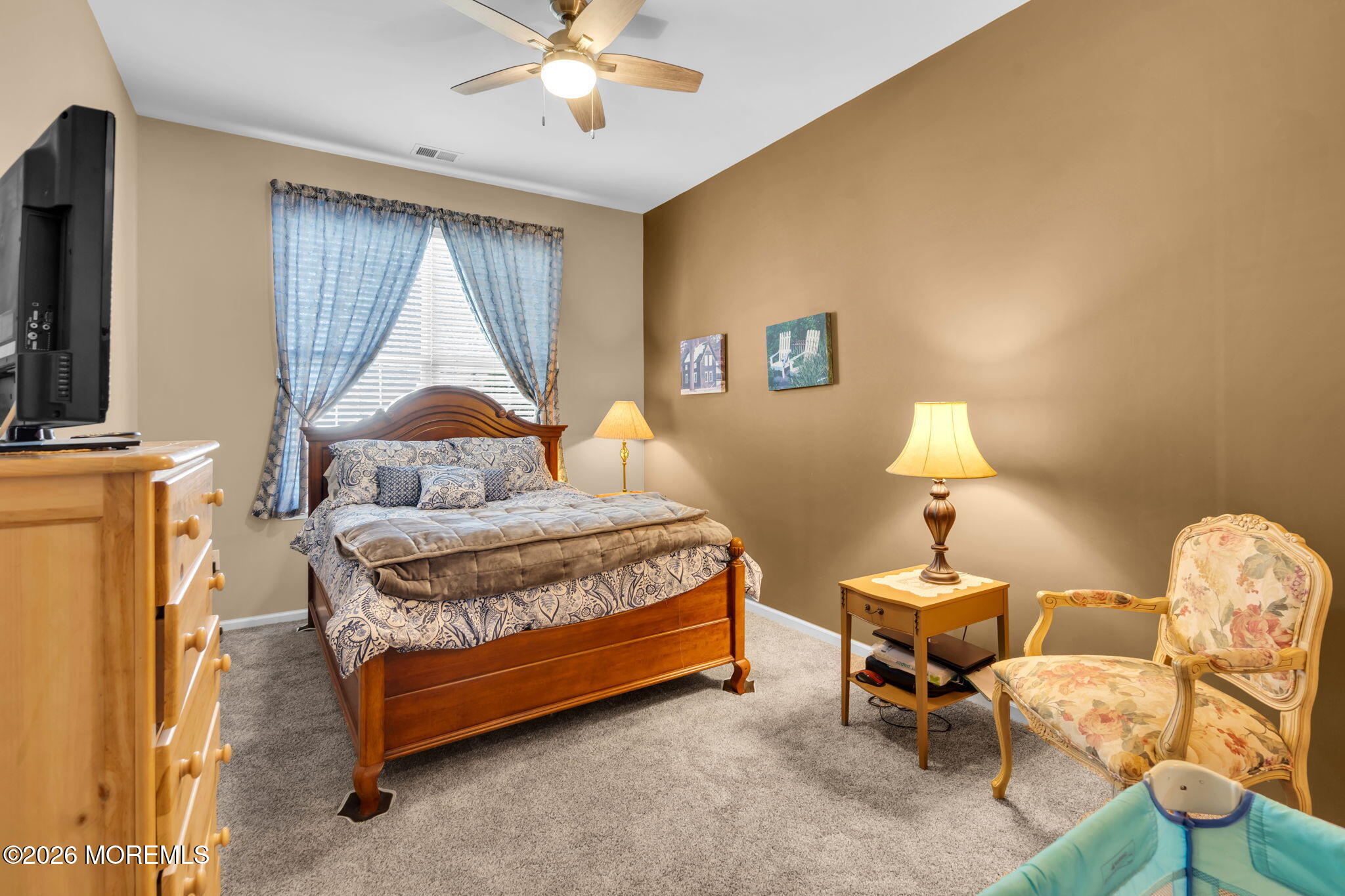 56 Pond View Circle Barnegat, NJ 08005 - Photo 22 of 32 a bedroom with a bed and a chandelier