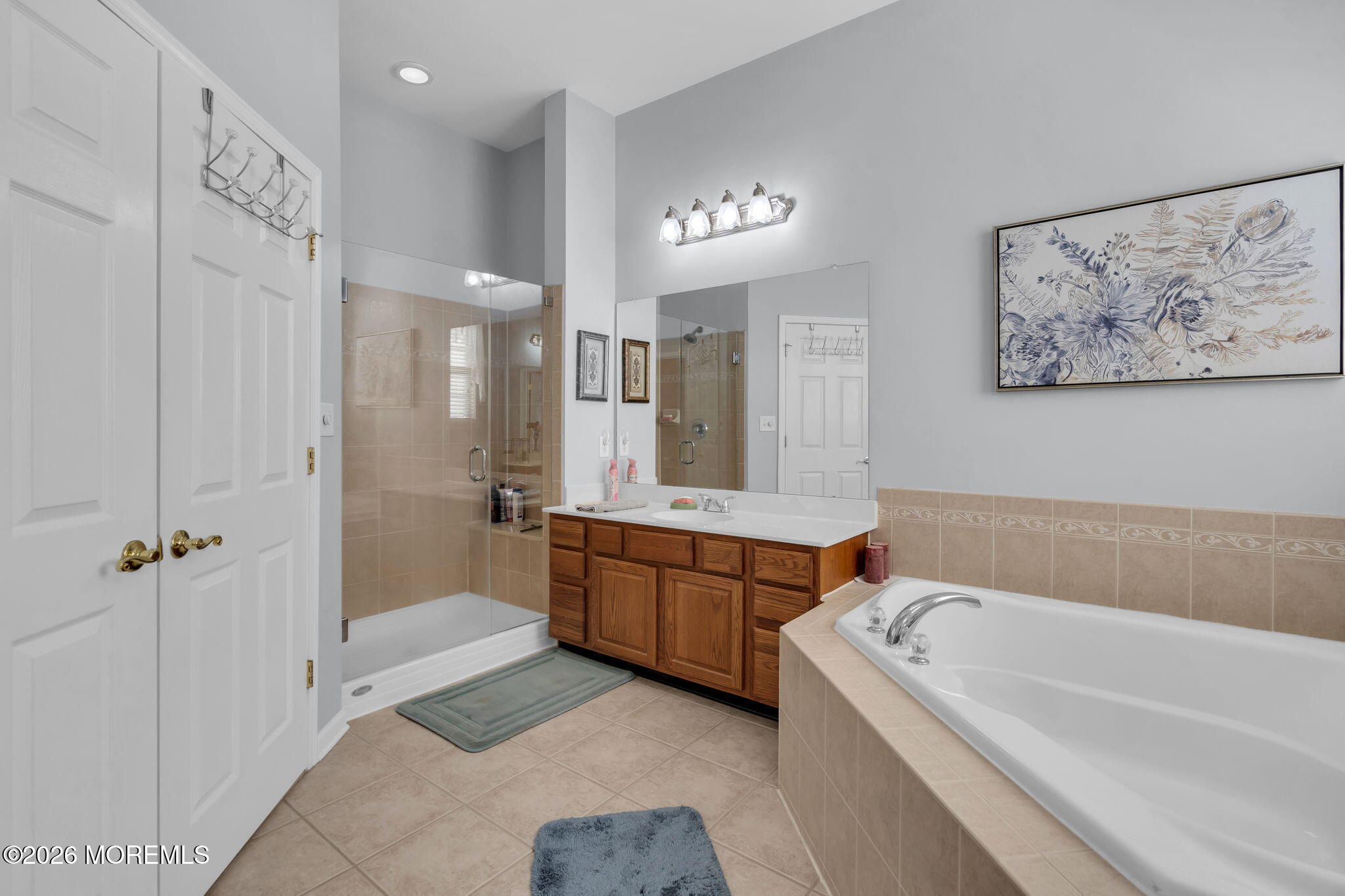 56 Pond View Circle Barnegat, NJ 08005 - Photo 26 of 32 a bathroom with a tub a sink and mirror