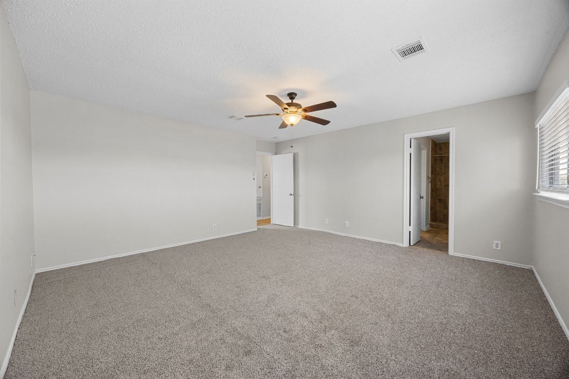 1326 Lakeside Loop Round Rock, TX 78665 - Photo 16 of 29 a view of an empty room with a ceiling fan