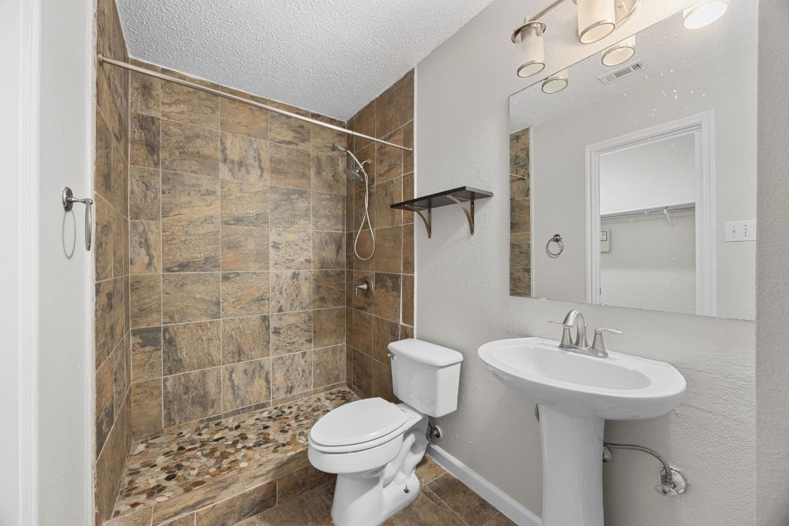 1326 Lakeside Loop Round Rock, TX 78665 - Photo 18 of 29 a bathroom with a sink toilet and shower