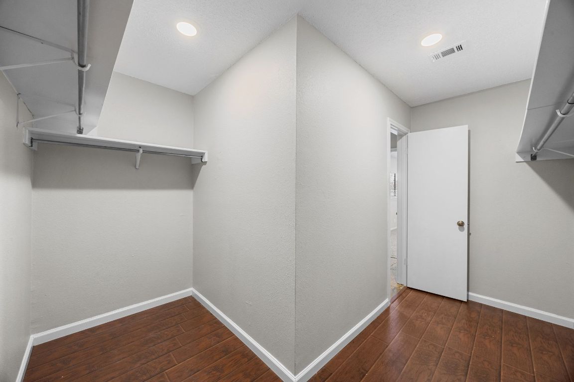 1326 Lakeside Loop Round Rock, TX 78665 - Photo 19 of 29 a view of walk in closet with wooden floor