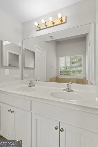 a white bath tub sitting next to a window