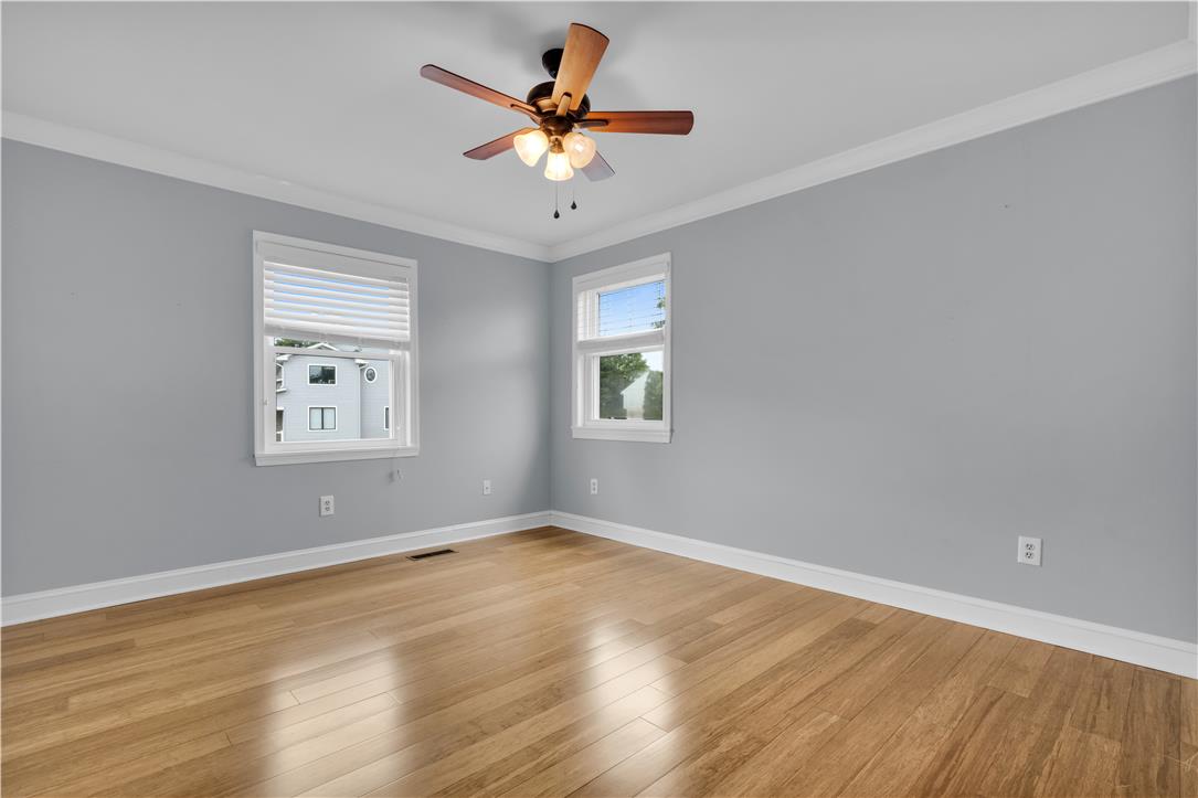 3396 Darien Road Bethlehem, PA 18020 - Photo 25 of 44 Hardwood floors and generous windows elevate this comfortable bedroom.