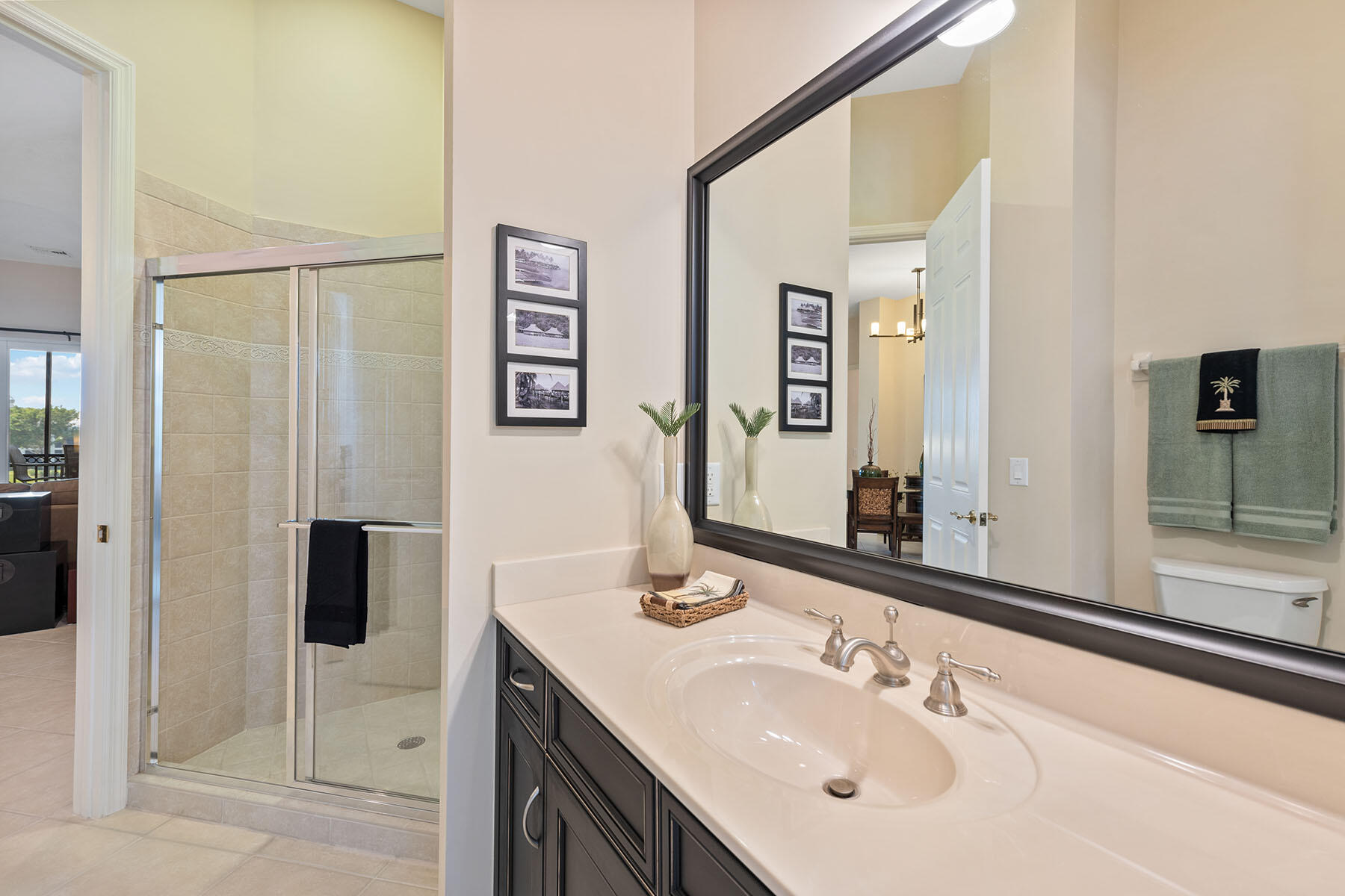 9263 Museo Circle, Unit 202 Naples, FL 34114 - Photo 16 of 45 a bathroom with a sink and mirror