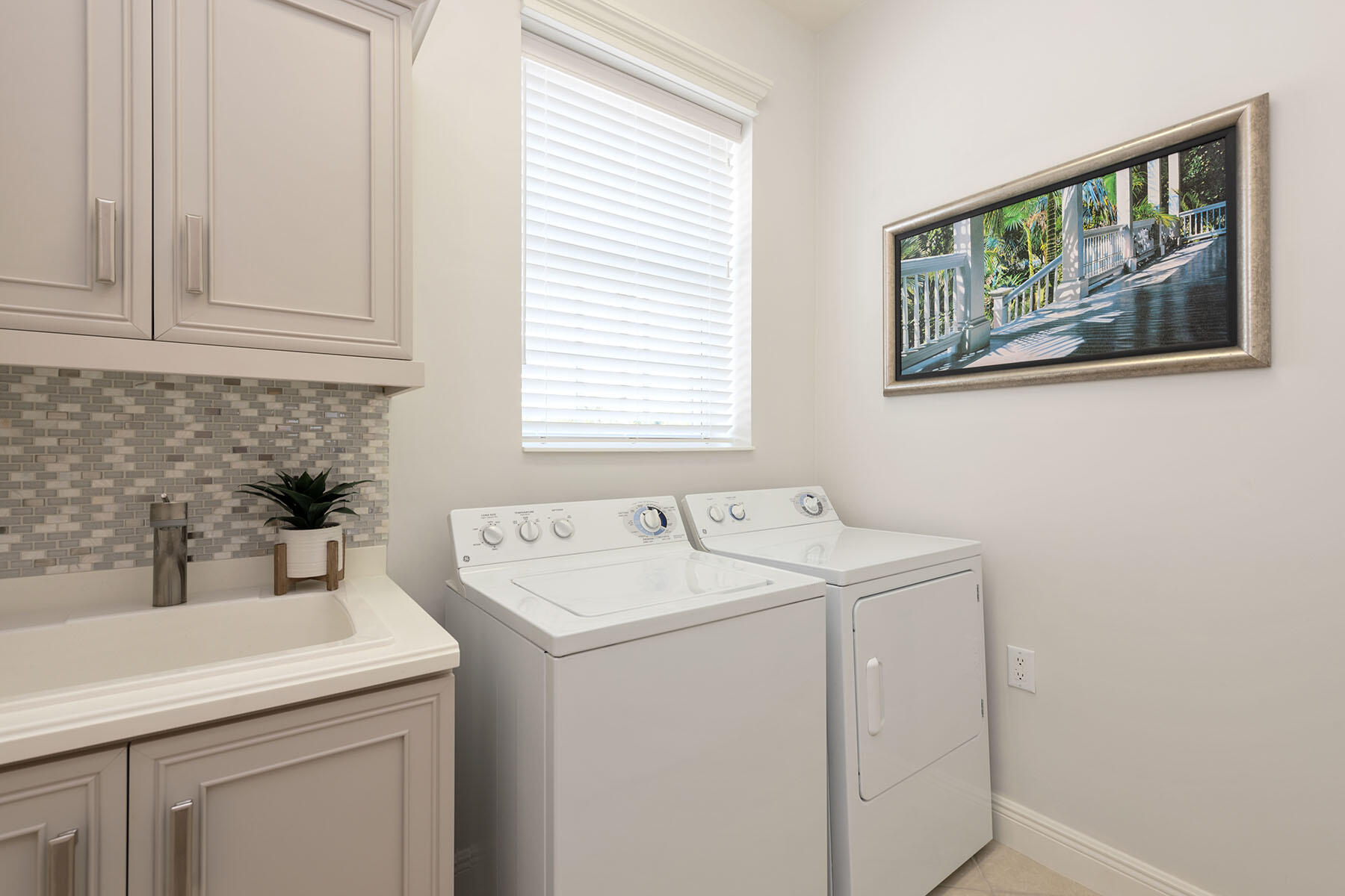 9263 Museo Circle, Unit 202 Naples, FL 34114 - Photo 17 of 45 a utility room with dryer and washer
