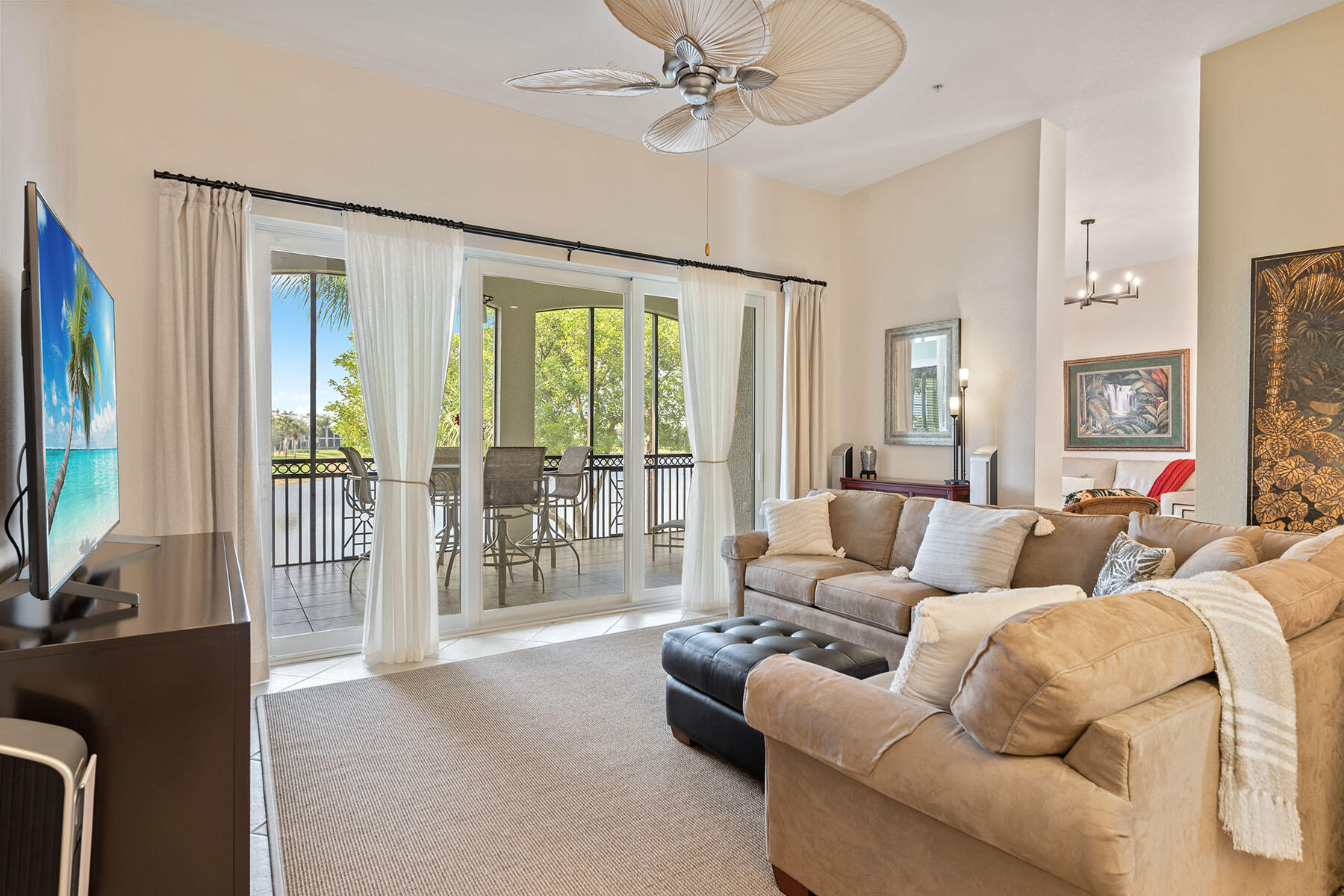 9263 Museo Circle, Unit 202 Naples, FL 34114 - Photo 2 of 45 a living room with furniture and a flat screen tv
