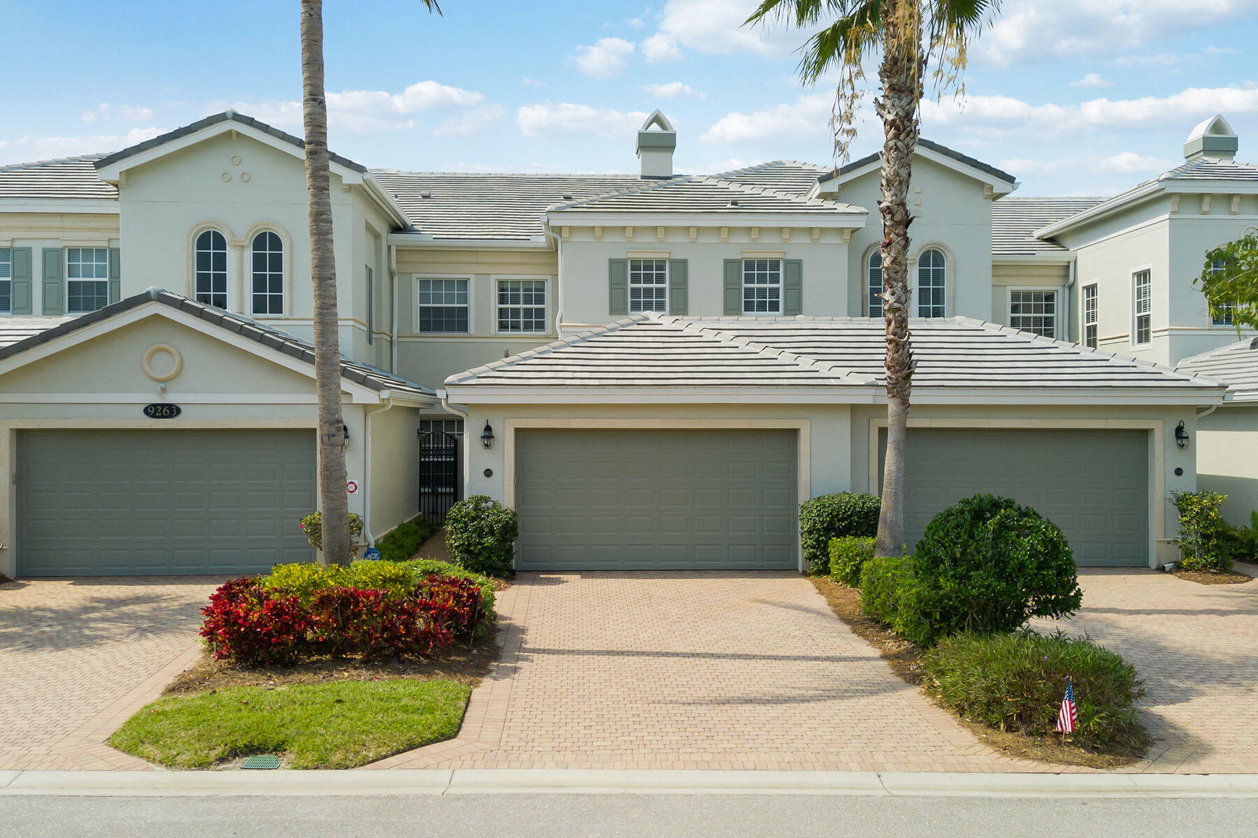9263 Museo Circle, Unit 202 Naples, FL 34114 - Photo 22 of 45 a front view of a house with a garden