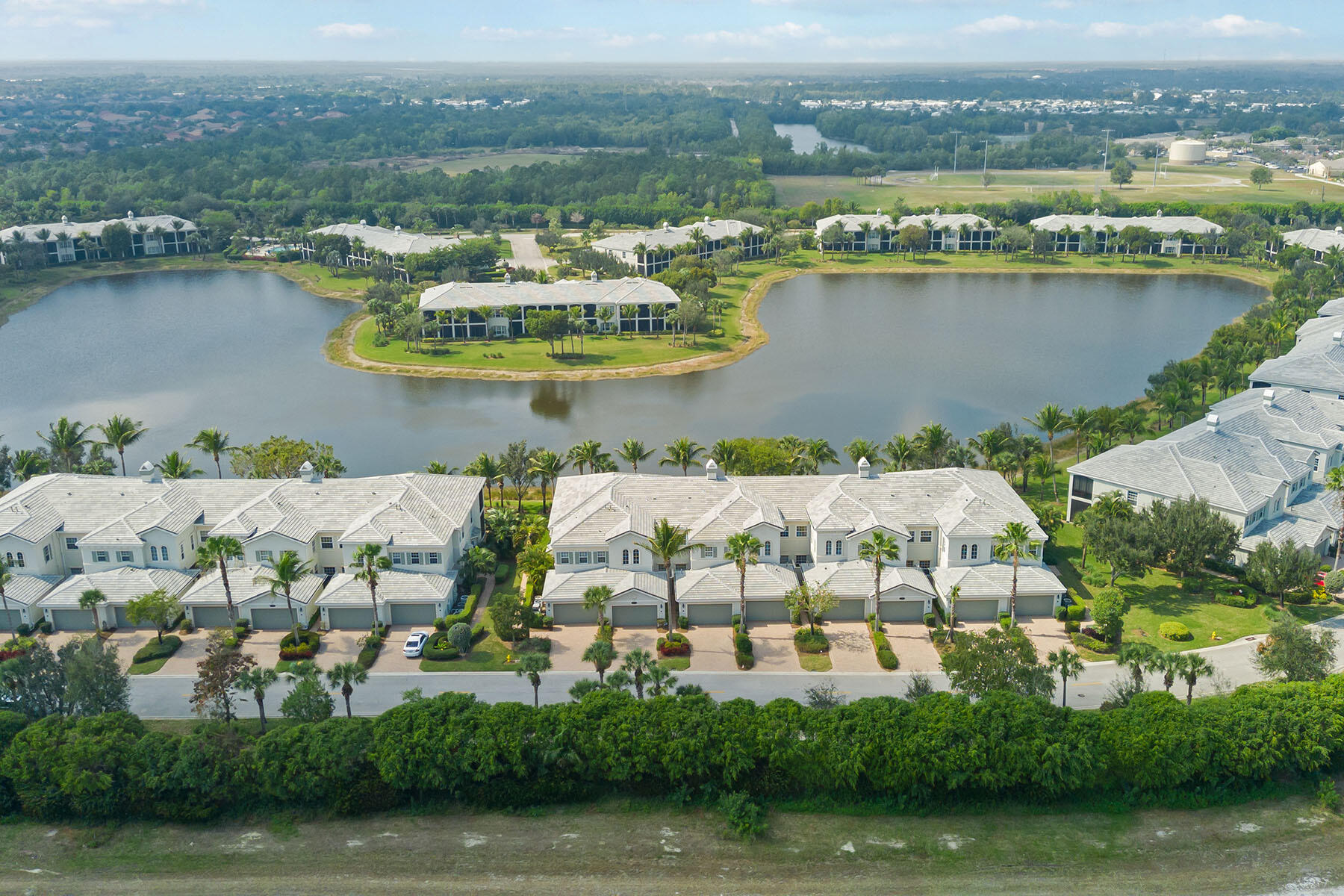 9263 Museo Circle, Unit 202 Naples, FL 34114 - Photo 24 of 45 an aerial view of ocean and residential houses with outdoor space