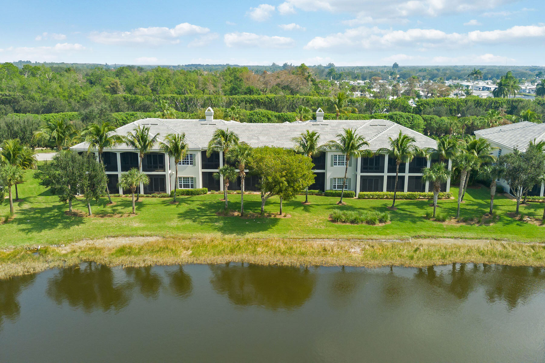 9263 Museo Circle, Unit 202 Naples, FL 34114 - Photo 27 of 45 an aerial view of residential houses with lake view