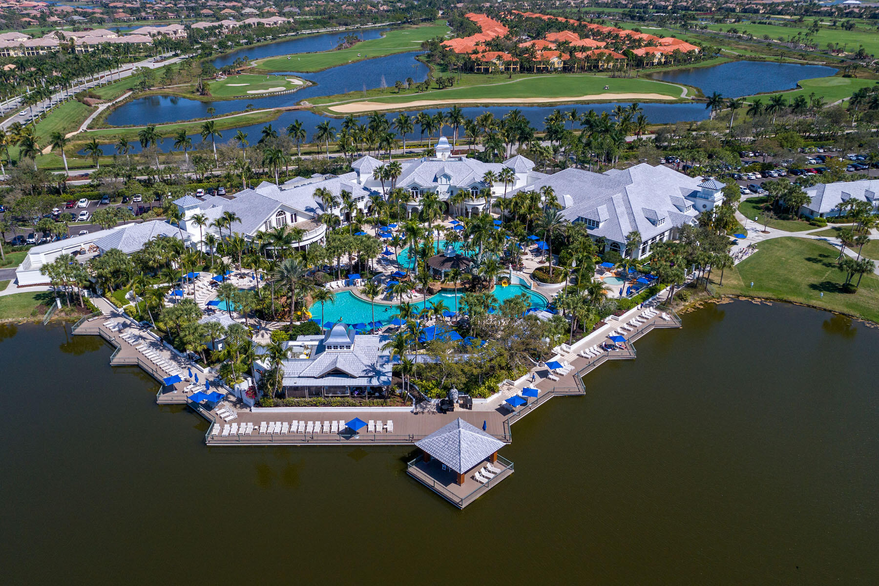 9263 Museo Circle, Unit 202 Naples, FL 34114 - Photo 42 of 45 an aerial view of a house with a garden and lake view
