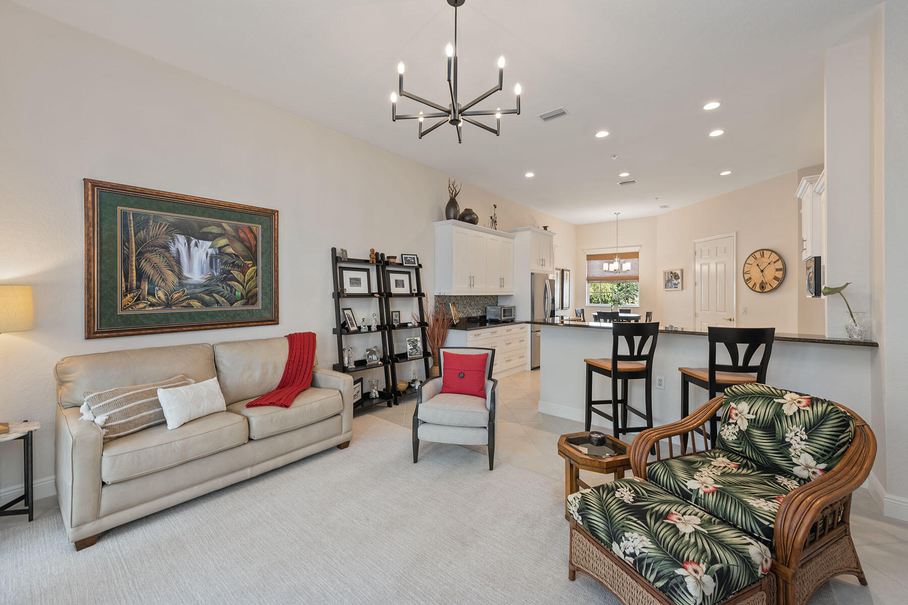 9263 Museo Circle, Unit 202 Naples, FL 34114 - Photo 5 of 45 a living room with furniture kitchen view and a chandelier