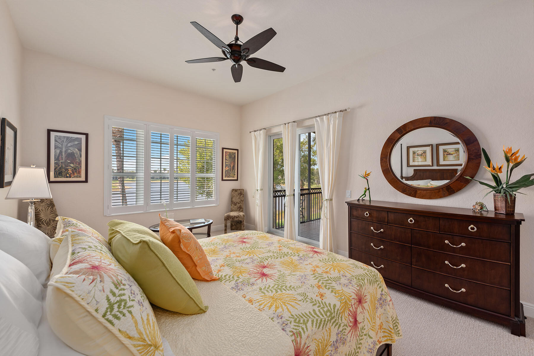 9263 Museo Circle, Unit 202 Naples, FL 34114 - Photo 10 of 45 a bedroom with a bed a mirror on dresser and a window