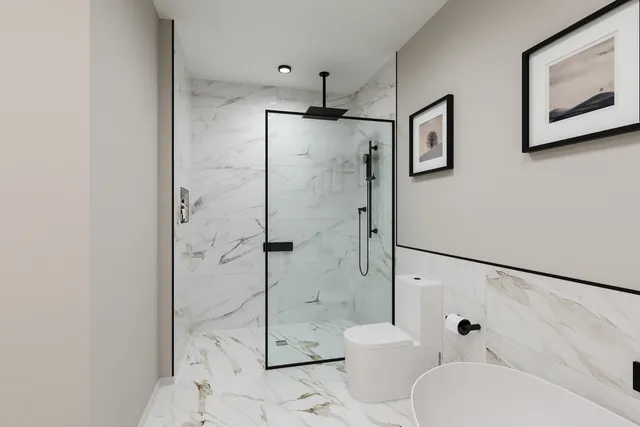 a bathroom with a shower toilet and sink