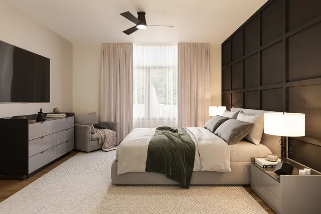 a spacious bedroom with a bed and a flat screen television