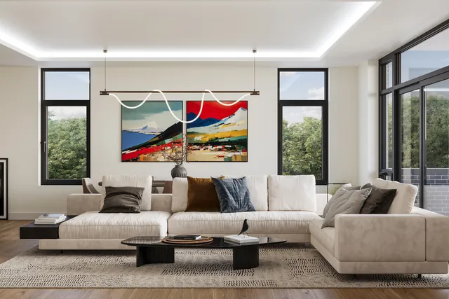 a living room with fireplace furniture and a large window