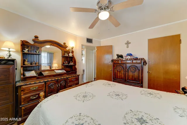 a bed room with a bed and a television