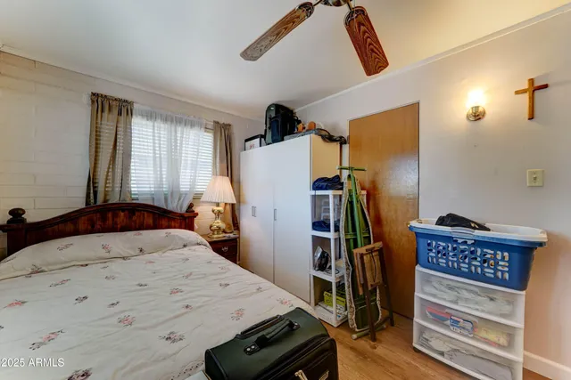 a bed room with a bed and a television