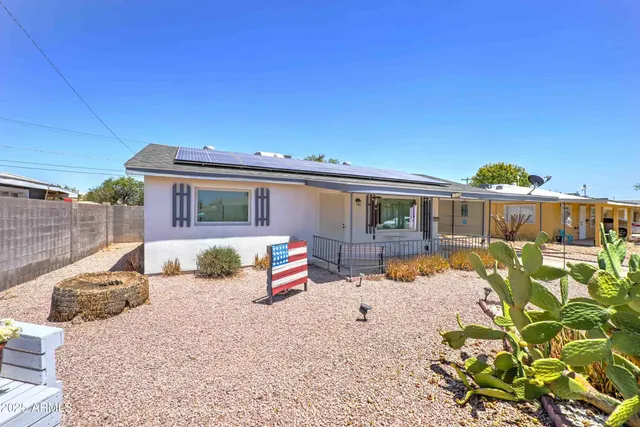 a front view of a house with patio