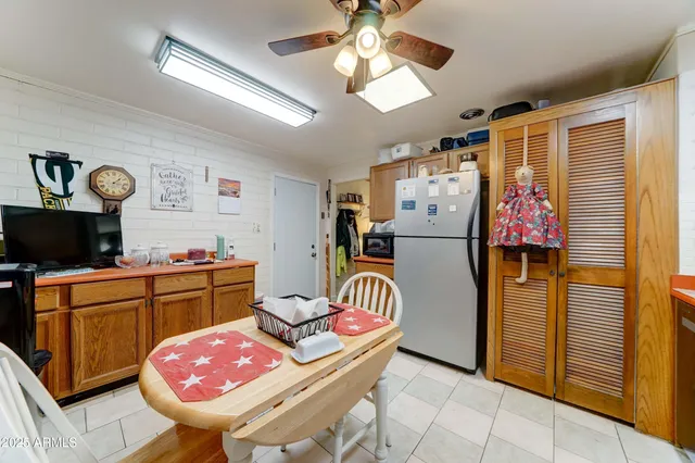 a kitchen with stainless steel appliances kitchen island granite countertop a refrigerator a sink and dishwasher
