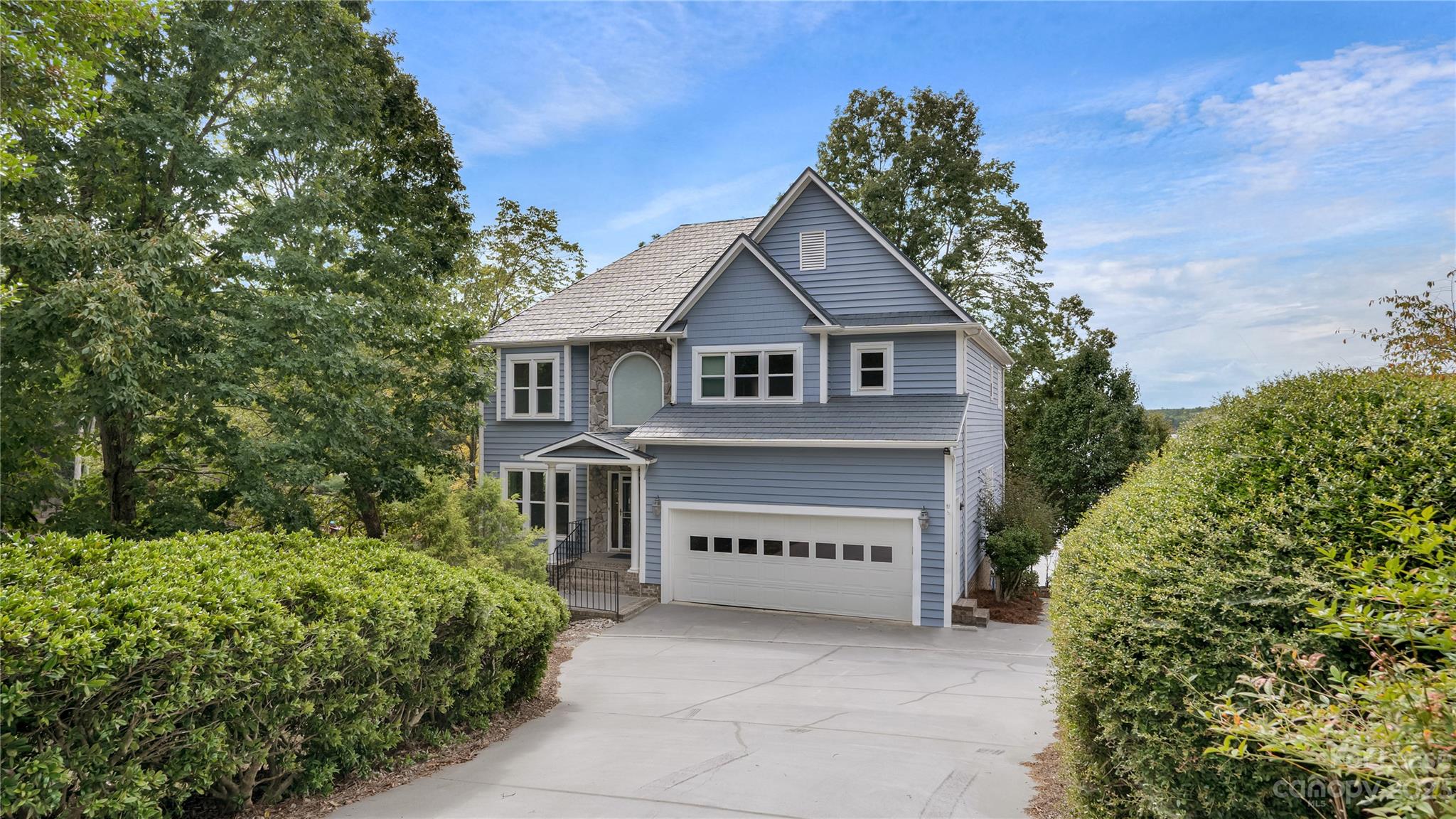 29025 Beaver Run Tega Cay, SC 29708 - Photo 1 of 40 a view of a house with a small yard and plants