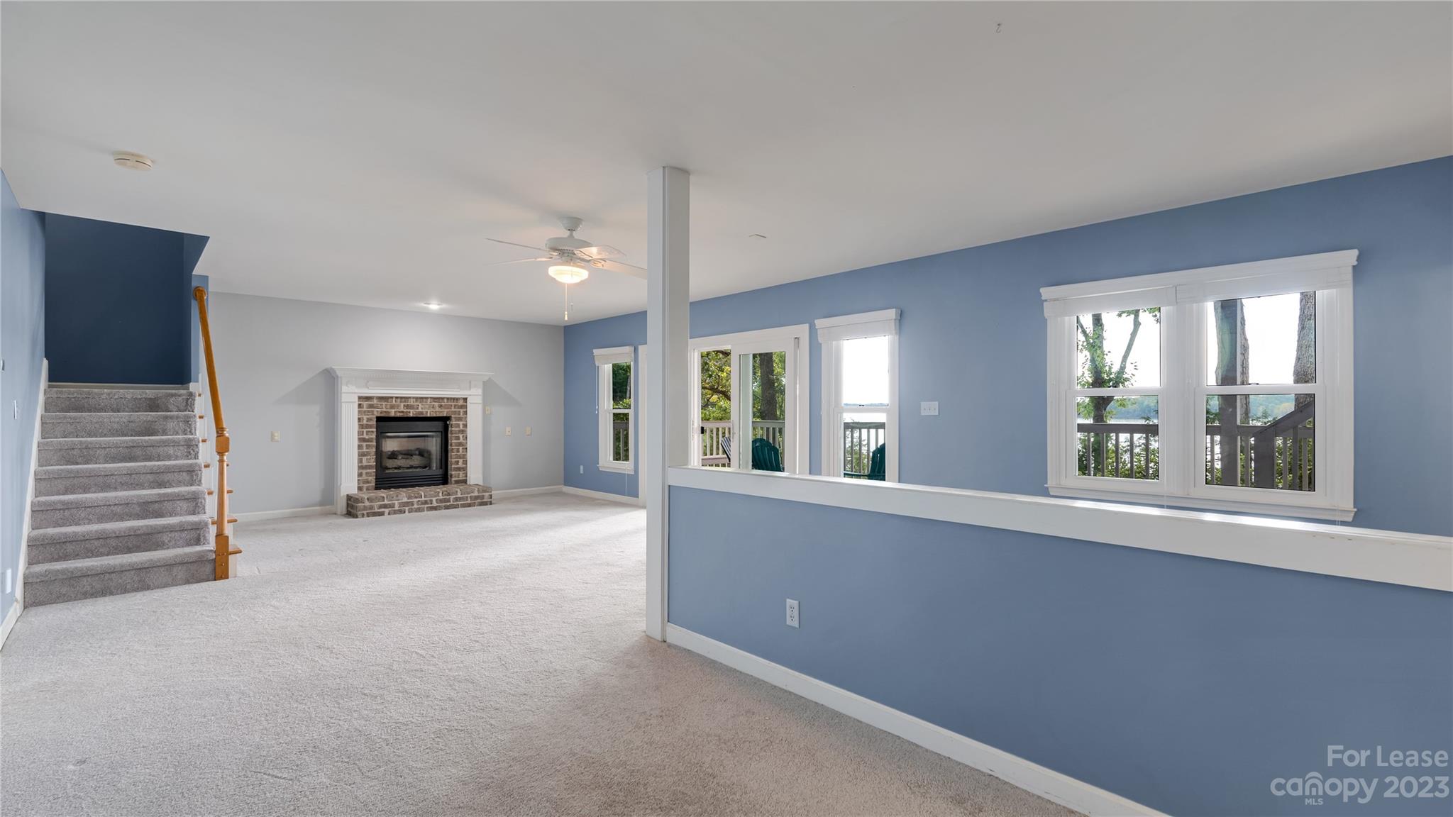 29025 Beaver Run Tega Cay, SC 29708 - Photo 29 of 40 an empty room with fireplace and windows