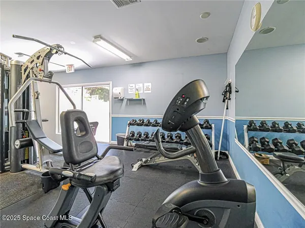 a room with lots of gym equipment