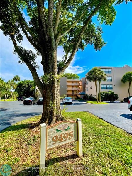 9495 Evergreen Place, Unit 405 Davie, FL 33324 - Photo 1 of 17 a view of a swimming pool with a patio